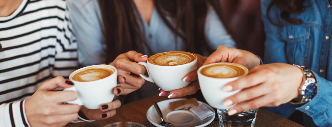 Three,Young,Women,Enjoy,Coffee,At,A,Coffee,Shop