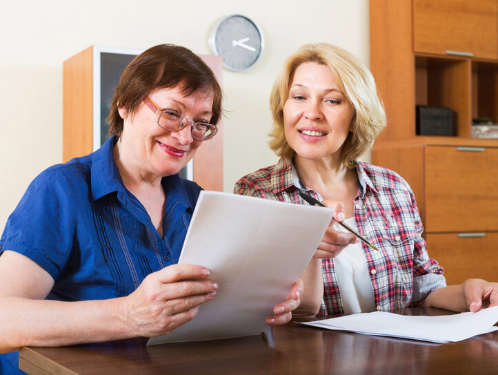 Notary officer helping aged client